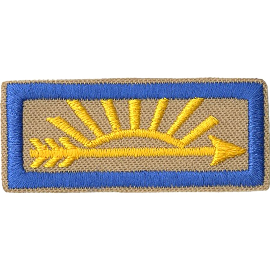 Arrow of Light rank emblem: a gold arrow on a tan bar patch