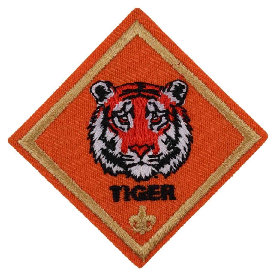 Tiger rank emblem: a tiger's head on an orange diamond patch