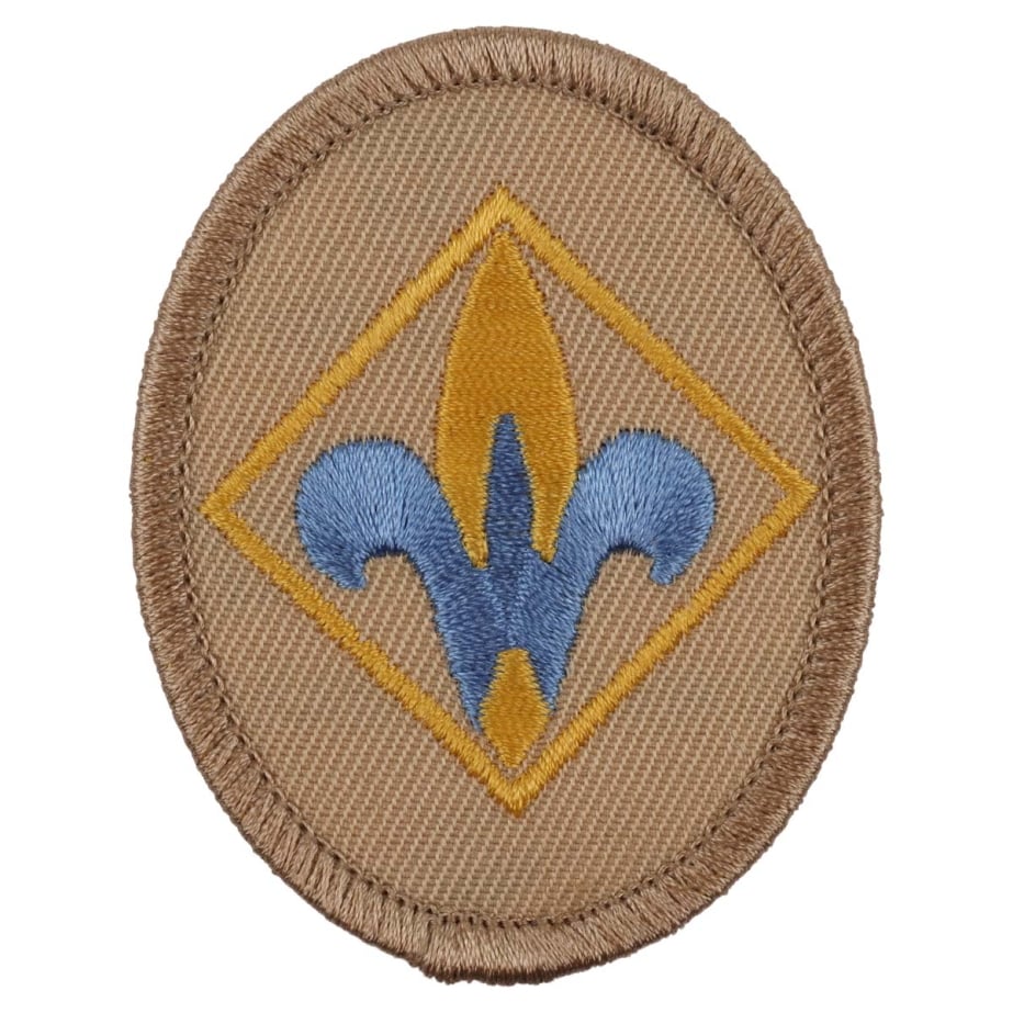 Webelos rank emblem: a fleur-de-lis on a tan oval patch