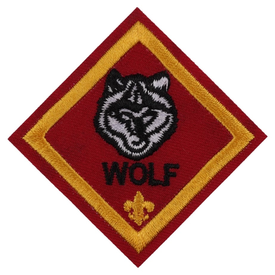 Wolf rank emblem: a wolf's head on a red diamond patch
